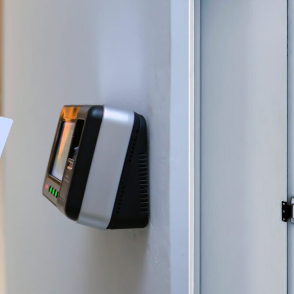 Office man using the id card to scan at the access control.